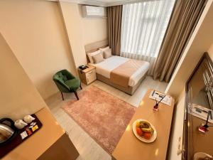 Postel nebo postele na pokoji v ubytování Şimal Hotel
