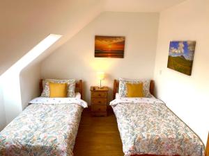 Postel nebo postele na pokoji v ubytování Slieve League House B&B
