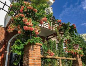 a house with flowers on the side of it at Autumn Bay Retreat in Hoi An +117 photos
