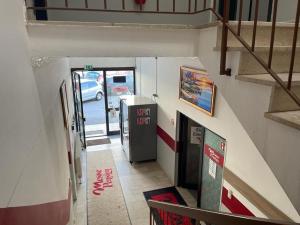 a view of a hallway with a gas station at Pension Messe in Feldkirchen