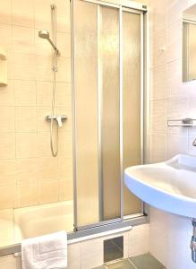 a bathroom with a shower and a sink at Gasthof 'Zum alten Turm' in Haslach an der Mühl