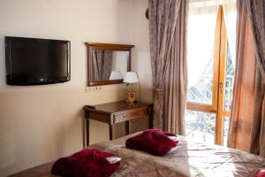 Postel nebo postele na pokoji v ubytování Romantik Spa Hotel