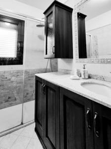 a bathroom with a sink and a shower at Casa Vacanze "LA TERRAZZA" in Leporano +23 photos