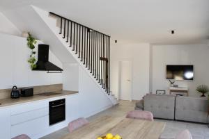 a living room with a table and a couch at Villa Bora - Blue Flat Green Flat in Slatine