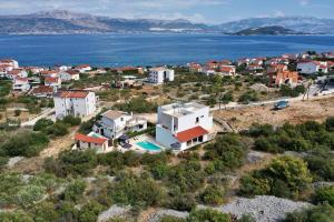 an aerial view of a town and the water at Villa Bora - Blue Flat Green Flat in Slatine