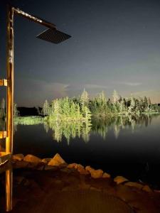 a view of a body of water with trees at Sable Point Cottage (Lakeside 7-Person Hot Tub & Outdoor Shower) in Grand River