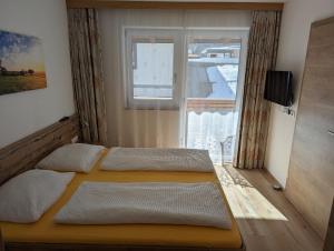 Posteľ alebo postele v izbe v ubytovaní Appartements Gotthardt