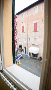 a view of a street from a train window at Casa Emilia [centro storico] in Imola