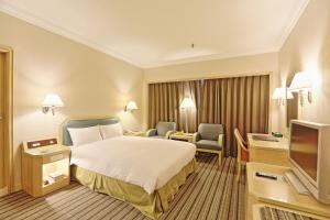 Voodi või voodid majutusasutuse Santos Hotel toas