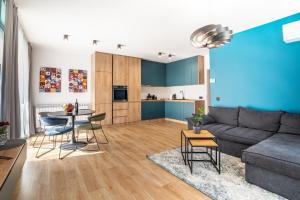 a living room with a couch and a table at Paradise Luxury Apartments in Sofia