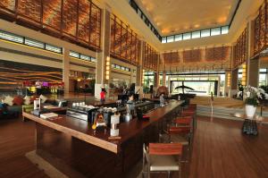 a lobby with a long bar in a building at Crowne Plaza Hailing Island, an IHG Hotel in Yangjiang