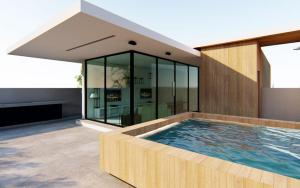 a house with a swimming pool in front of a building at BAMBOO APARTAMENTO MONOAMBIENTE, Equipetrol Norte - con Garaje in Santa Cruz de la Sierra