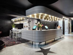 a bar with two computers on top of it at MABI City Centre in Maastricht