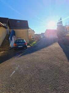 a car parked on a driveway in a house at studio cosy in Vieux-Charmont