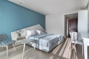 Voodi või voodid majutusasutuse Kassandra Bay Resort, Suites & Spa toas