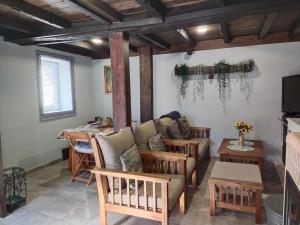 a living room with a couch and a table at Vivienda Vacacional La Yaya in Ortiguero