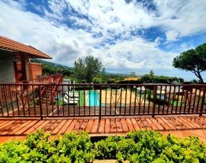 a deck with a fence and a playground at B&B Iolì Vesuvio in Ercolano