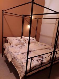 Llit o llits en una habitació de HÔTEL ETOILE DU SUD