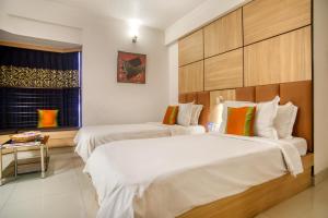 Postel nebo postele na pokoji v ubytování Roland Hotel + 37 fotografií