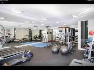 a gym with exercise equipment in a room at 9408 Luxury Apartment Close to Hastings Street in Noosa Heads