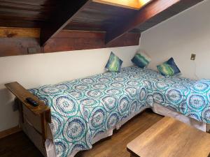 Een bed of bedden in een kamer bij Hermosas habitaciones para 1 - 2 o 4 personas