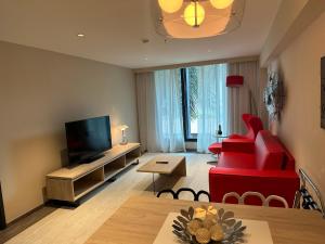 TV a/nebo společenská místnost v ubytování Gran Evenia Panamá Hotel + 37 fotografií