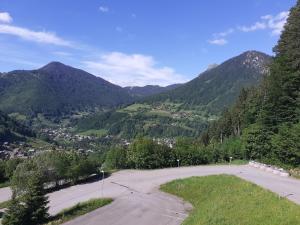 a parking lot with a view of a mountain at Emilie hanard in Saint-Jean-d'Aulps