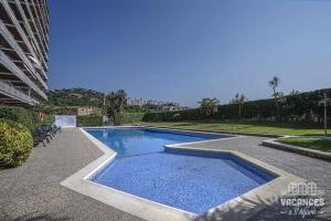 Bazén v ubytování Caleta Sol 303 Apartamento con piscina comunitaria nebo v jeho okolí