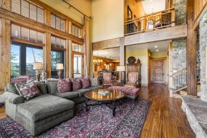 a living room with a couch and a table at Gorgeous Deer Valley mountain home minutes from the slopes in Park City