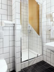 a bathroom with a shower and a sink at MABI City Centre in Maastricht +85 photos