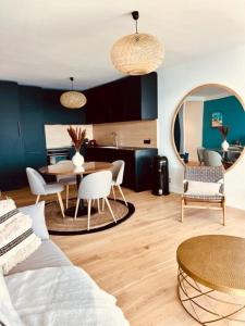 a living room with a table and a dining room at Les Baux 3 in Sanary-sur-Mer