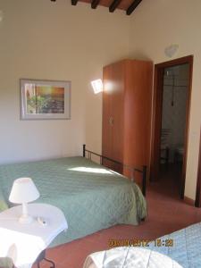 Postel nebo postele na pokoji v ubytování Agriturismo Conca Verde + 37 fotografií