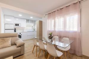 A kitchen or kitchenette at Neptuno Deluxe