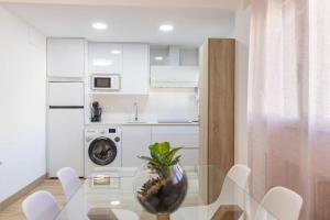 A kitchen or kitchenette at Neptuno Deluxe