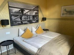 Postel nebo postele na pokoji v ubytování Harzhotel Warnstedter Krug