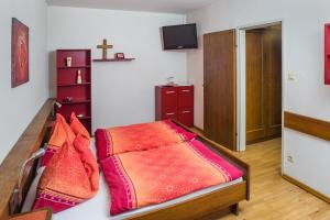 Uma cama ou camas num quarto em Gasthof Dangl