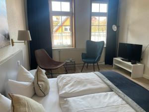 Postel nebo postele na pokoji v ubytování Harzhotel Warnstedter Krug