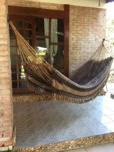 a hammock on the porch of a house at Elviajero in Campinas