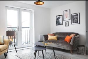 a living room with a couch and a table at Wellington House in Hull