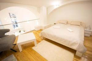 Postel nebo postele na pokoji v ubytování Parliament Exclusive Gallery