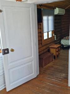 an open door in a room with a bedroom at Camping Fuente de Piedra in Fuente de Piedra