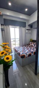 Ένα ή περισσότερα κρεβάτια σε δωμάτιο στο Mistow LoopTower@Limketkai