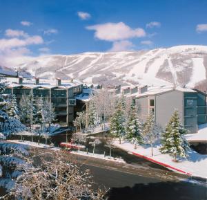 a resort in the snow with a mountain in the background at Silver King in Park City