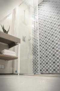 a bathroom with a shower with a glass door at Il Bordone - affittacamere a Manarola, Cinque Terre in Manarola