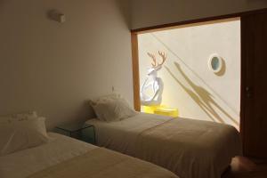 Кровать или кровати в номере Groove-Wood Loft