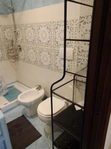 a bathroom with a toilet and a sink and a shower at DOMINO HOUSE Montariello in Sorrento