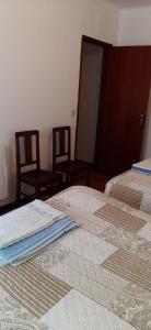 Ein Bett oder Betten in einem Zimmer der Unterkunft Apartamento Abril