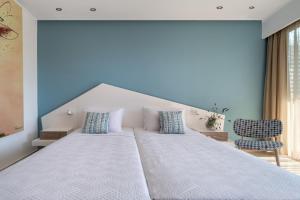 Voodi või voodid majutusasutuse Kassandra Bay Resort, Suites & Spa toas