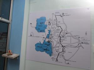 a map hanging on a wall in a room at Ashish Guest House, Udaipole in Udaipur