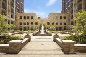 a courtyard with a fountain in front of a building at Beautiful 2 BR Apartment At Pentagon City With Gym in Arlington